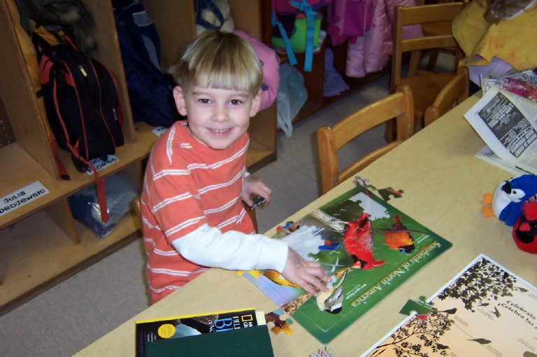 Hayden exploring the bird kit and posters