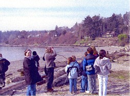 Participants observing and learning by the lake