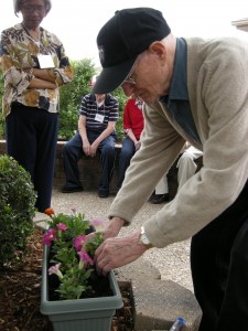 participant planting flowers during the event