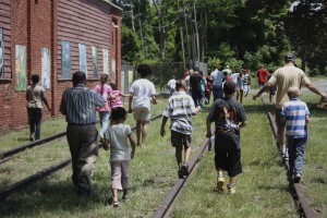 particpants walking along old train tracks